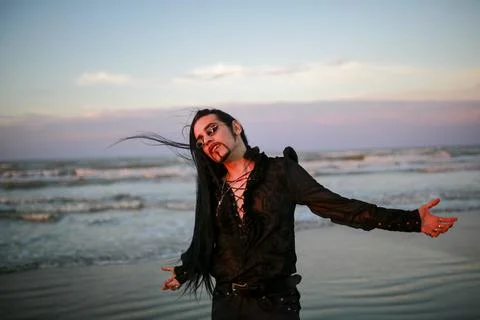 Handsome goth dark vampire emo guy with long hair Foto stock