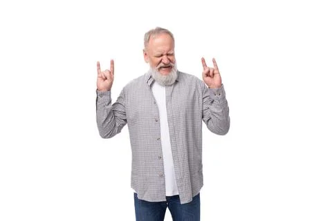 Handsome gray-haired elderly man in a shirt shows with his hands that he is cool 스톡 사진