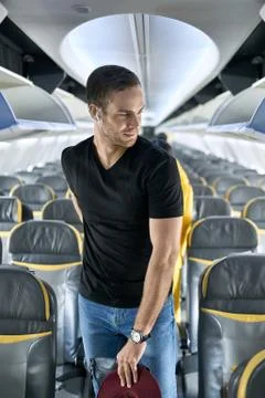 Handsome guy in airplane Stock Photos