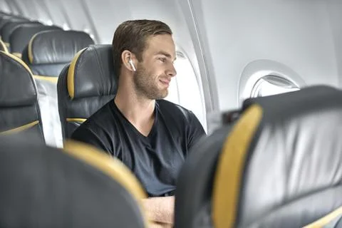 Handsome guy in airplane Foto stock