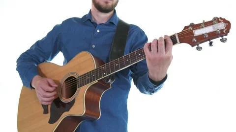 Handsome guy with beard playing acoustic guitar. White background. Isolated Stock Footage 135235351