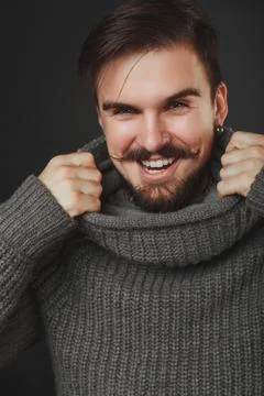 Handsome guy with beard in wool pullover Stock Photos