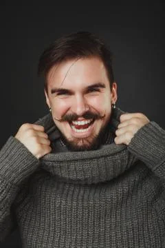 Handsome guy with beard in wool pullover Stock Photos