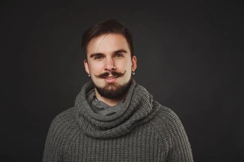 Handsome guy with beard in wool pullover Stock Photos