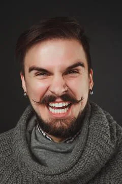 Handsome guy with beard in wool pullover Stock Photos