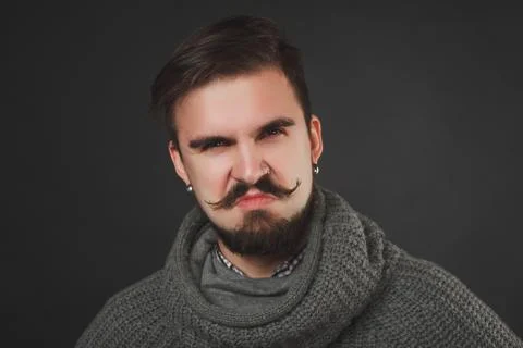 Handsome guy with beard in wool pullover Stock Photos