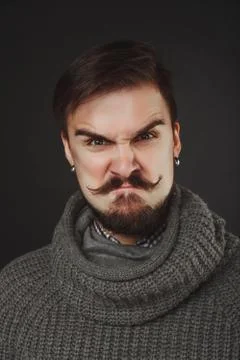 Handsome guy with beard in wool pullover Stock Photos