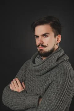 Handsome guy with beard in wool pullover Stock Photos