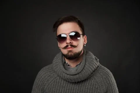 Handsome guy with beard in wool pullover Stock Photos