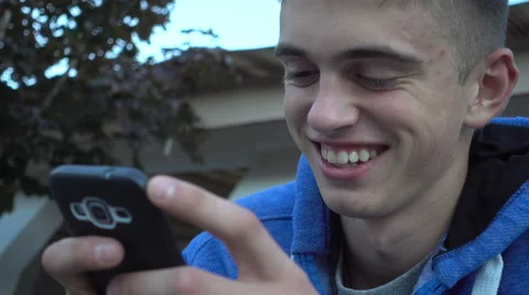 Handsome Guy chating texting sms with Mobile Sell Phone on the Day Street Stock Footage