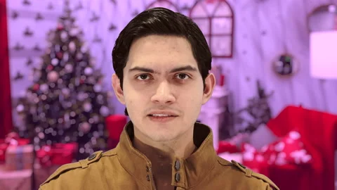 Handsome guy with Christmas background, 4K ProRes Stock Footage 164638940