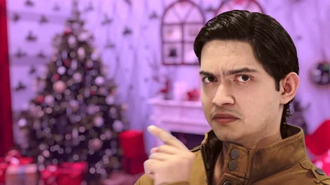 Handsome guy with Christmas background, 4K ProRes Video stock 164639074