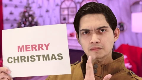 Handsome guy with Christmas background, 4K ProRes Stock Footage 164639151