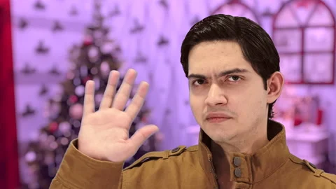 Handsome guy with Christmas background, 4K ProRes Stock Footage 164639357
