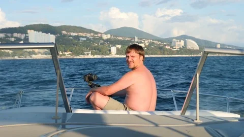 A handsome guy does selfie on board a yacht. Stock Footage 80799080