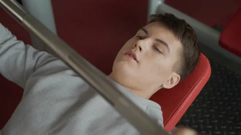 Handsome guy doing exercises with a barbell in the gym. Stock Footage 154894275