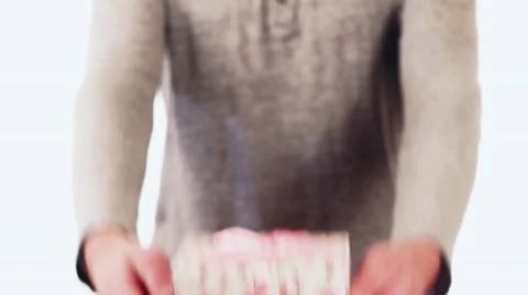 Handsome guy gives a gift in the box for his birthday. Cute guy standing on a Stock-Footage 58627352
