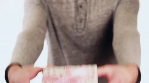 Handsome guy gives a gift in the box for his birthday. The guy opens the box, Video stock 58627379