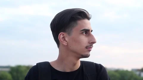 Handsome Guy Looking at the Camera and Smiling. Hipster Very Stylish and Video stock 62852901