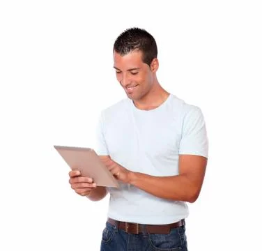 Handsome guy looking at his tablet pc Stock Photos