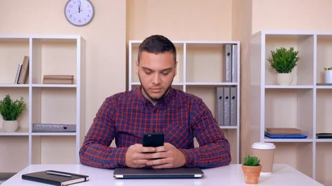 Handsome guy messaging on cellular Stock Footage 112089783