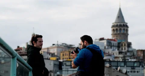 Handsome guy model is posing for a male photographer Видео 162027592