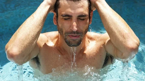Handsome guy in pool Video stock 89463743