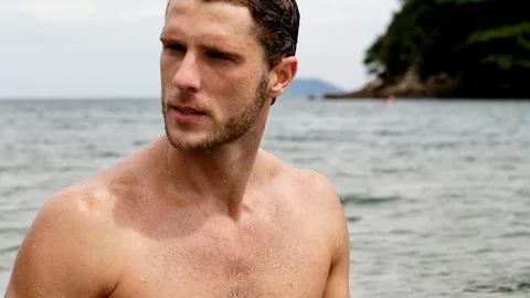 Handsome guy in sea Stock Footage 93995840