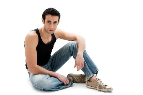 Handsome guy sitting on floor Stock Photos