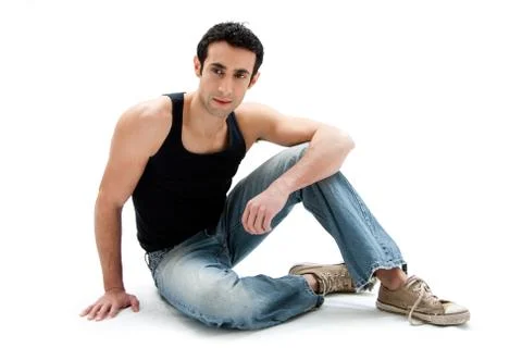 Handsome guy sitting on floor Stock Photos