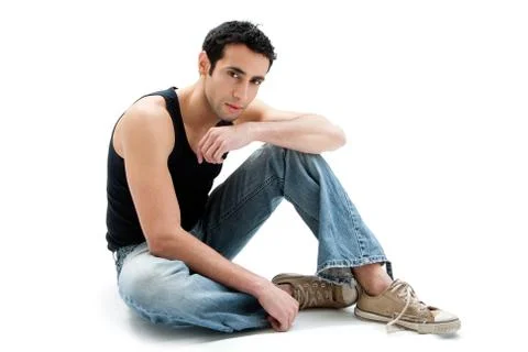 Handsome guy sitting on floor Foto stock
