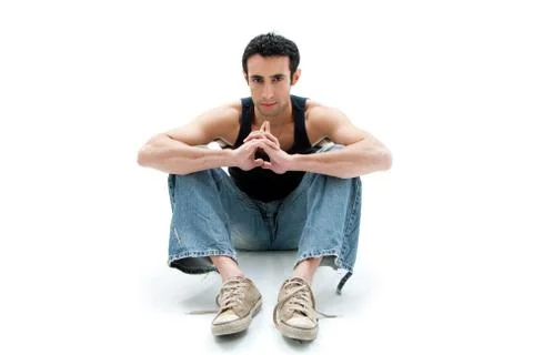 Handsome guy sitting on floor Foto stock