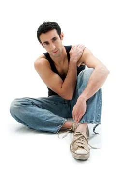 Handsome guy sitting on floor Stock Photos
