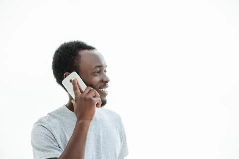 Handsome guy with smartphone looking at copy space. Stock Photos