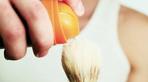 Handsome guy squeezes shaving gel. Video stock 59311523