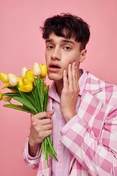 Handsome guy in stylish clothes jacket fashion gestures with hands self Stock Photos