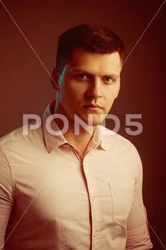 Handsome guy with stylish hair. Man with serious young face. Macho wear Stock Photos