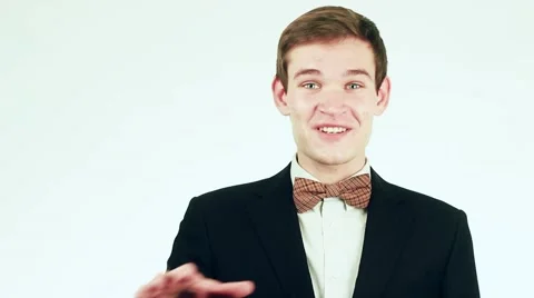 Handsome guy in a suit looking at the camera and talking. Man television Stock-Footage 59311396