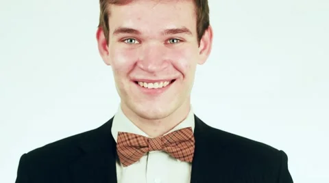 Handsome guy in a suit looking at the camera and smiling. 動画素材 59311433