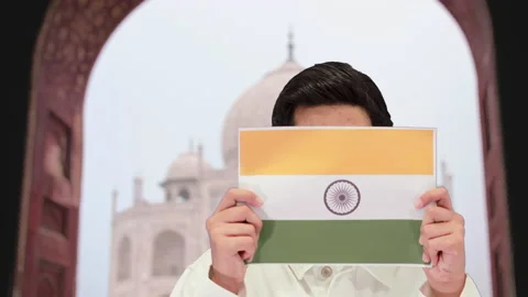 Handsome guy with taj mahal background, 4k Video stock 164329211