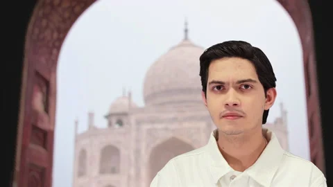 Handsome guy with taj mahal background, 4k Stock Footage 164329308