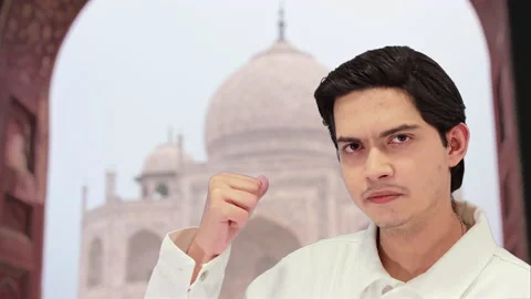 Handsome guy with taj mahal background, 4k Stock Footage 164329326