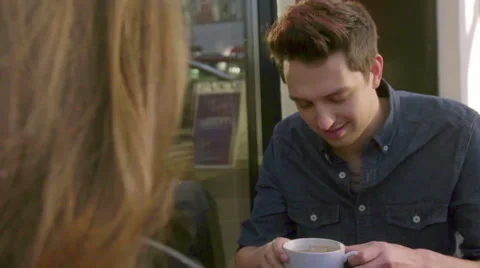 Handsome guy takes sip of coffee Stock Footage 61716279