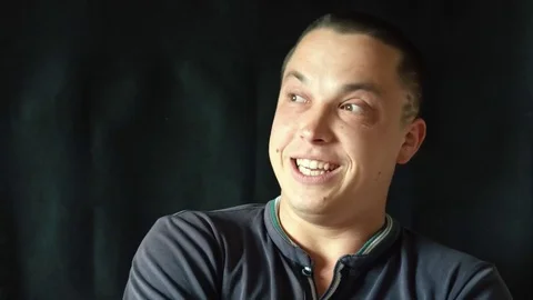 Handsome guy talking and laughs to camera Stock-Footage 75531574