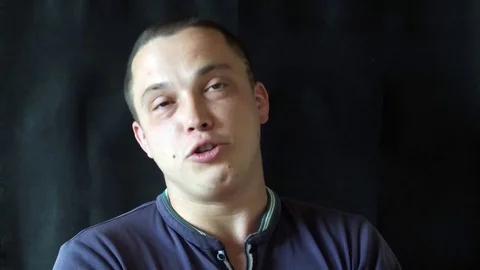 Handsome guy talking to camera Stock Footage 75531336