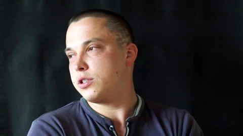 Handsome guy talking to camera Stock Footage 75531389