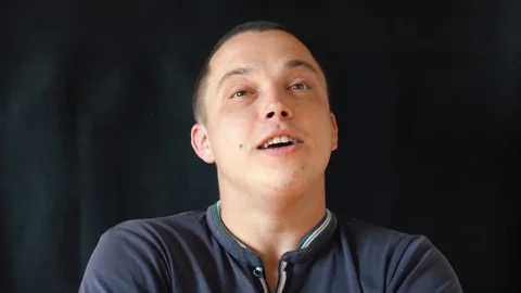 Handsome guy talking to camera Stock Footage 75531430