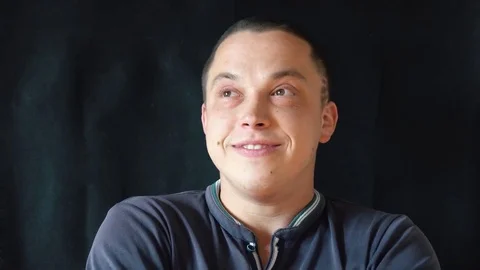 Handsome guy talking to camera Stock Footage 75531482