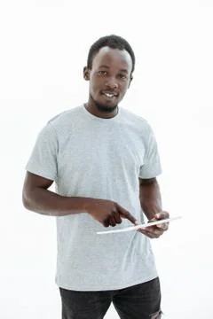 Handsome guy tapping on the digital tablet screen Stock Photos