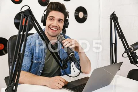 Handsome happy young male radio host broadcasting Stock Photos
